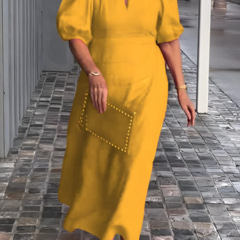 Yellow maxi dress with puff sleeves, square neck, and studded pockets in a 5XL size.