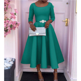 A2XL green midi dress with long sleeves, boat neck, and A-line silhouette, featuring pockets.