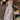A light gray vintage-style tea dress with spaghetti straps and a midi length, suitable for daytime wear. The dress features a fitted waist and a flowing skirt, perfect for casual or formal occasions.