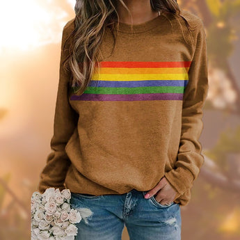 Red multicolor striped crewneck sweatshirt, casual autumn fashion, shown on a person paired with jeans.