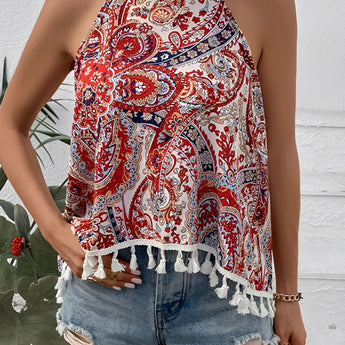 Red paisley halter top with tassel trim for boho summer festival wear, featuring a sleeveless design and a tie-neck detail.