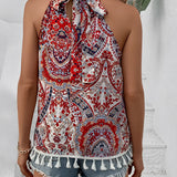 Red paisley halter top with tassel trim worn by a person, showcasing bohemian style suitable for summer festivals.