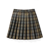 Red plaid pleated tartan skirt in a mini kilt style, featuring a classic preppy schoolgirl look with an eye-catching pattern.