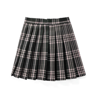 Red plaid pleated tartan skirt styled as a preppy schoolgirl mini kilt, showcasing a classic tartan pattern with prominent pleats, worn by a person standing outdoors near trees.