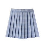 A red plaid pleated tartan skirt designed in a preppy schoolgirl style, resembling a mini kilt with classic checkered patterns in shades of red and black.