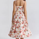 Red Rose Print Vintage Fit & Flare Dress featuring a garden party style, displayed on a mannequin with emphasis on the waist and flared hem, showcasing short sleeves and a classic round neckline.