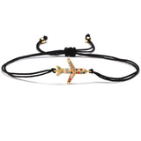 Red string starfish charm bracelet with adjustable band, featuring multicolor crystals and gold-tone accents.