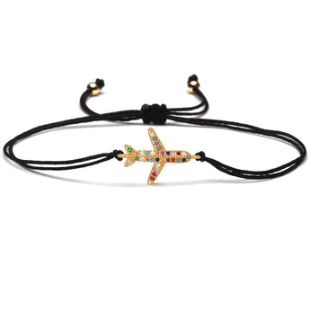 Red string starfish charm bracelet with adjustable band, featuring multicolor crystals and gold-tone accents.