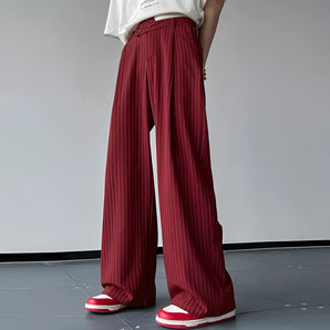 Red striped palazzo pants with a high waist and wide legs, suitable for formal wear, shown on a standing model.