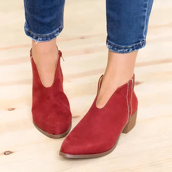 Red suede pointed toe women's ankle booties with a slip-on design and low heel, shown in size 42.