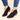 Red suede pointed toe women's ankle booties with a low heel in size 42, shown in a slip-on style. The booties are paired with denim pants, highlighting their sleek design and vibrant color.