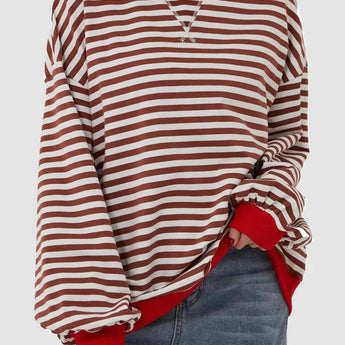 
A red and white striped long sleeve crew neck blouse with button cuffs, featuring a tailored fit and soft fabric, shown in an XL size.
