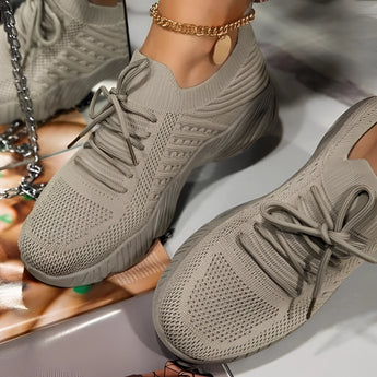 Red women's breathable mesh sneakers in a lightweight design, shown in a Persimmon colorway, size 43. The shoes feature a stylish athletic appearance suitable for walking, blending fashion with functionality.