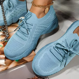 Light blue women's breathable mesh sneakers with a lightweight design, featuring a white and azure color scheme, suitable for athletic activities and walking.