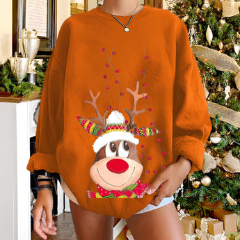 Women's orange 2XL Christmas sweatshirt featuring a festive reindeer with a red nose, designed as part of holiday apparel. The sweatshirt has long sleeves and is suitable for celebrating the Christmas season.