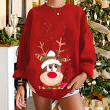Women's oversized red sweatshirt featuring a festive reindeer with a red nose design, perfect for holiday celebrations. The sweatshirt is styled with long sleeves and pairs well with cozy winter apparel.