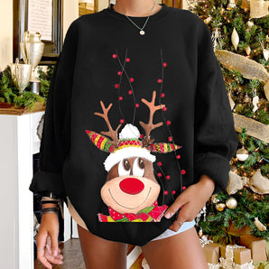 Women's black sweatshirt featuring a festive reindeer with a red nose; designed for Christmas; includes long sleeves and a ribbed collar; suitable for holiday events; available in size 2XL.