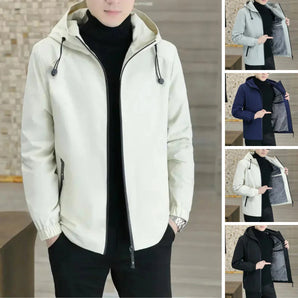 Reversible men's lightweight spring jacket with adjustable hood, featuring black and white design, worn by a standing model. The jacket highlights a stylish neck and shoulder area, emphasizing its fashionable outerwear appeal.
