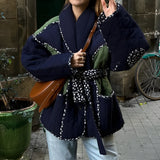Reversible navy blue quilted kimono jacket featuring a stylish urban boho design, displayed on a model. The jacket has long sleeves and a unique quilted texture that combines traditional and modern fashion elements.