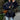 Reversible navy blue quilted kimono jacket featuring a stylish urban boho design, displayed on a model. The jacket has long sleeves and a unique quilted texture that combines traditional and modern fashion elements.