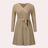 A ribbed black wrap dress featuring long sleeves and a V-neck in a skater style, shown in a khaki color and XL size.