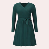 
A long sleeve, V-neck, ribbed wrap dress in a skater style, shown in a vibrant green color and size XL.