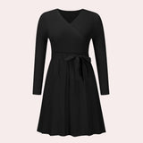 Ribbed black long sleeve wrap dress with a V-neck in a skater style, suitable for day or formal occasions, displayed in size XL.