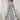 Ribbed grey high neck sweater dress featuring long sleeves, a fitted silhouette, and a knee-length hem, perfect for elegant autumn fashion.