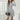 Ribbed grey high neck sweater dress in XL size, featuring long sleeves and a fitted silhouette, perfect for elegant autumn fashion.