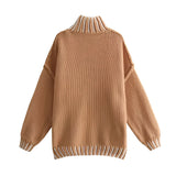 Unisex oversized ribbed mock neck wool sweater in black and tan with long sleeves and a cozy fit.