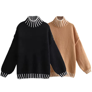 Unisex oversized ribbed mock neck wool sweater in black and tan, featuring long sleeves and a cozy pullover design.