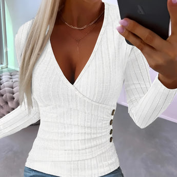 White slim fit blouse with ribbed texture and V-neck design, featuring button details and long sleeves.