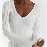Ribbed V-neck cream maxi sweater dress with long sleeves, featuring a fitted waist and elegant fall fashion design.