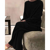 Black ribbed women's loungewear set in Nero color, featuring a long-sleeve top and matching pants, designed for comfort and cozy wear.