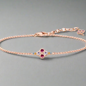 Rose Gold Bracelet by Thaddaeus Jewelry featuring multicolor gemstones, adjustable length 17-22cm, displayed on a white background.