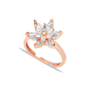 A nature-inspired rose gold marquise diamond flower engagement ring featuring intricate floral designs and a sparkling centerpiece gemstone.