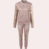 Rose gold velvet tracksuit with sequin detail, showcasing the luxurious texture and shimmering embellishments on the shoulders, neck, and waist areas, designed for women's fashion and activewear.