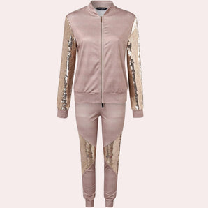 Rose gold velvet tracksuit with sequin detail, showcasing the luxurious texture and shimmering embellishments on the shoulders, neck, and waist areas, designed for women's fashion and activewear.