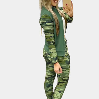 Rose gold velvet tracksuit with sequin detail, featuring a long-sleeve top and matching trousers in a camouflage pattern, shown in green color and XL size. The tracksuit is designed for women's luxury activewear, highlighting fashion design elements and a comfortable waist fit.