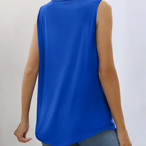 Woman wearing a royal blue sleeveless flowy summer top with back button closure, smiling and showing part of her arm and neck.