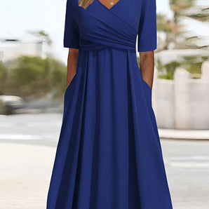Plus-size royal blue V-neck A-line midi dress with three-quarter sleeves.