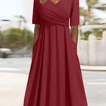 Plus size royal blue V-neck A-line midi dress with three-quarter sleeves.
