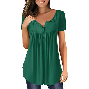 A woman wearing a royal blue pleated scoop neck blouse with short sleeves, smiling and showcasing the casual summer top.
