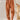 Rust orange high-waisted women's pleated pants made from corduroy fabric, styled in a vintage fashion, shown in 3XL size.