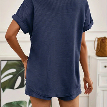 Rust red ribbed knit top displayed on a mannequin, showcasing short sleeves and a round neckline.