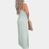 Sage green sleeveless maxi dress designed as a casual beach sundress, featuring a simple one-piece silhouette and a flowing, knee-length hem.