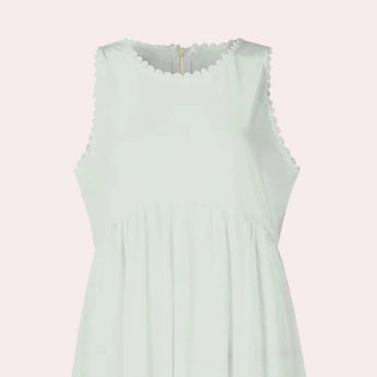Sage green sleeveless maxi dress designed as a casual beach sundress, featuring a flowing silhouette with a defined waistline.