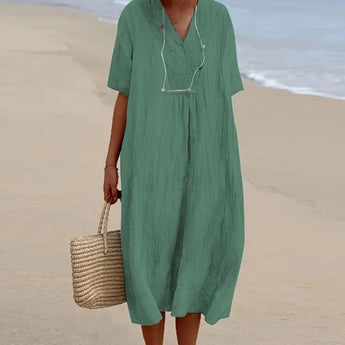 Sea Blue Linen Maxi Dress with a V-neck design, long sleeves, and a flowing silhouette, in a vibrant electric blue color. The dress is styled for casual, lightweight beachwear, perfect for warm weather outings.