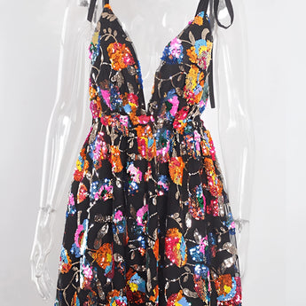 Sparkly festival outfit featuring a black sequin skater skirt and a black backless halter top in XL, displayed on a clothes hanger.