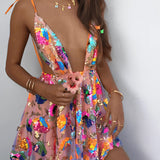 Woman wearing an orange sequin skater skirt and backless halter top, posing with one arm on her hip and the other by her side, suitable for festivals and parties.